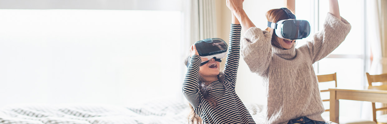 mother and daughter playing in virtual reality glasses